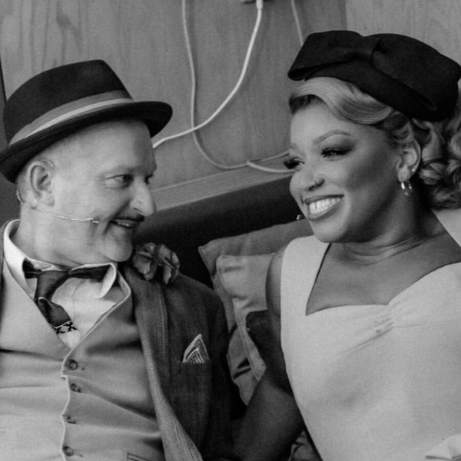 Mark Oxtoby as Natahan Detroit in Guys &amp; Dolls - Bridge Theatre (2023-2024) Seen here with Marisha Wallace as Miss Adelaide.