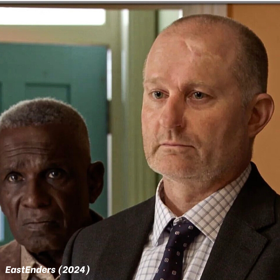 Mark Oxtoby as DI Moore in EastEnders (BBC) 2024. Seen here with Rudolph Walker as Patrick Trueman. Photo Credit: BBC/Jack Barnes/Kieron McCarron. Mark Oxtoby as DI Moore in EastEnders (BBC) 2024. Seen here with Rudolph Walker as Patrick Trueman. Photo Credit: BBC/Jack Barnes/Kieron McCarron.
